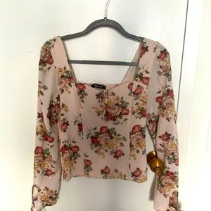 Long sleeve pink floral top with tie sleeves.
